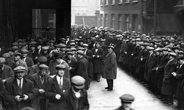 Labourers queue for work at the London docks in 1931.