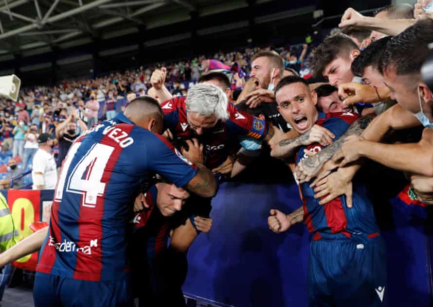 Levante celebrate during their wild 3-3 draw with Madrid.
