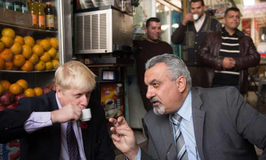 Boris Johnson has a coffee with Ziad al-Bandak, an adviser to the Palestinian president