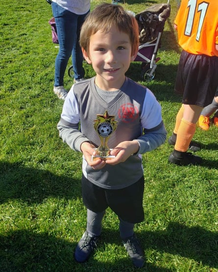 Image of a boy smiling at the camera.