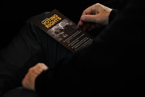 A man reads a "Know Your Voting Rights" pamphlet at an election observer training