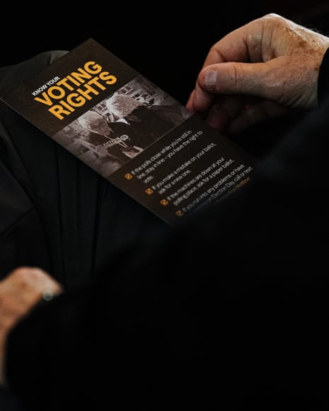 Closeup of a man with a "Know Your Voting Rights" pamphlet at an election observer training