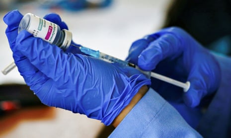 A healthcare worker prepares a dose of the AstraZeneca coronavirus vaccine