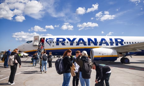 Passengers leaving a Ryanair plane at Athens International Airport in Athens, Greece, in March.