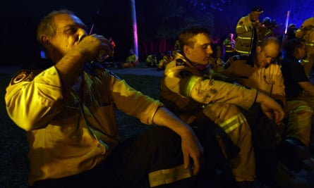 Firefighters take a break in Nana Glen, NSW.