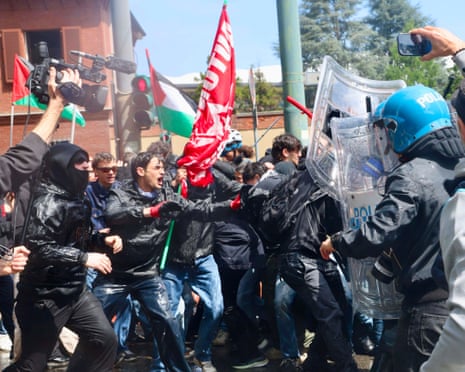 Demonstrators clashes with police during a May Day march, in Turin, Italy.