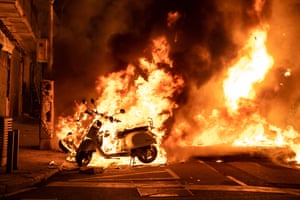 Barcelona, Spain. Burning motorcycles during another night of protests and riots in response to the arrest and imprisonment of rapper Pablo Hasél. The rapper has been accused of exalting terrorism and insulting the crown for the content of the lyrics of his songs