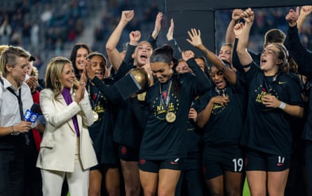 Sophia Smith (centre) of the Portland Thorns celebrates her MVP trophy after the NWSL Cup Final against Kansas City Current