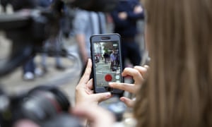A woman plays Pokémon Go in Downing Street