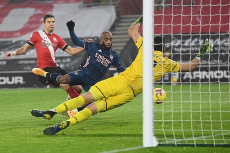Arsenal’s French striker Alexandre Lacazette (C) scores his team’s third goal.