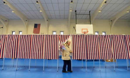 A voter leaves a polling booth during the New Hampshire Democratic primary in February 2020.