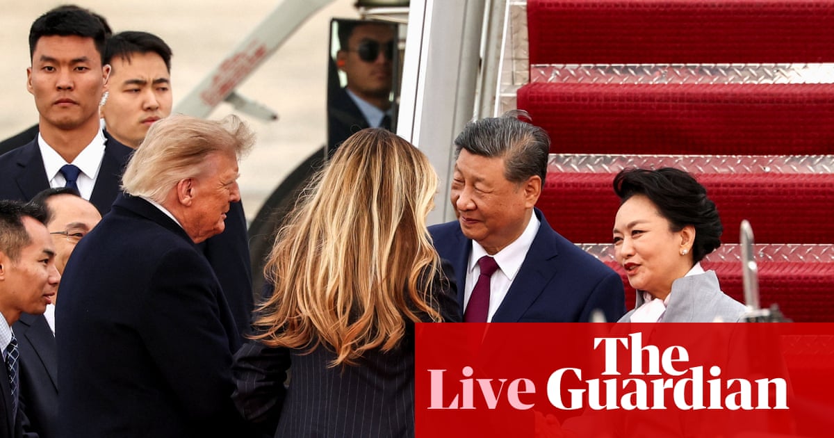 Trump greets Xi Jinping at airport in rare personal welcome ahead of US-China summit on sidelines of UN general assembly – live