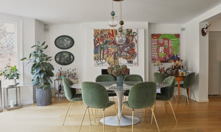 Green velvet chairs in the dining room.