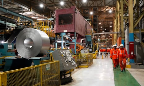 Steel workers work at the ArcelorMittal Dofasco steel plant in Hamilton, Ontario.