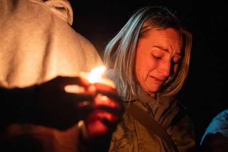 Woman cries at vigil