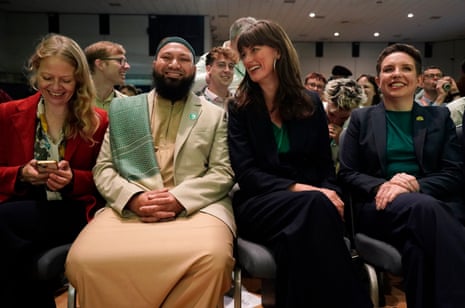 Green MP Siân Berry, Mothin Ali and Rachel Millward, the two co-deputy leader, and Green MP Carla Denyer listening to Zack Polanski’s speech.