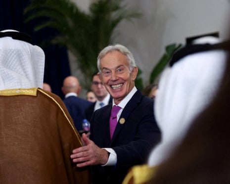 Tony Blair smiles at the camera as he greets world leaders’ at a summit on ending the Gaza war in Sharm el-Sheikh, Egypt