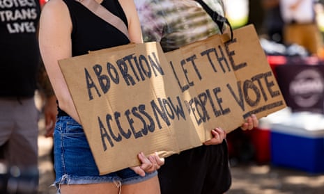 A woman carries a sign calling for access to abortion at a rally at the Texas state capitol in September.