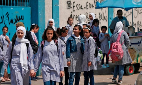 Pupils gather in front of a school run by the United Nations agency for Palestinian refugees in Gaza City.