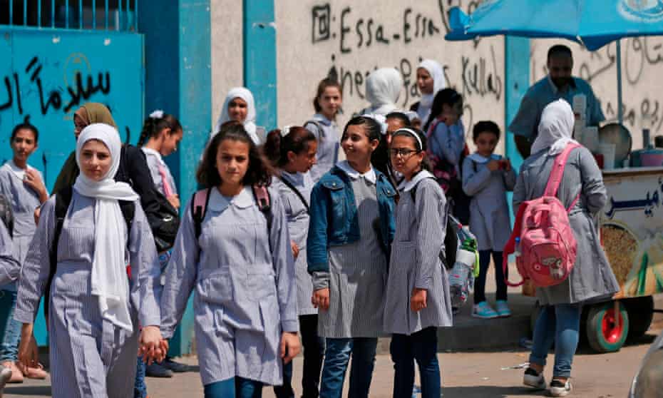 Pupils gather in front of a school run by the United Nations agency for Palestinian refugees in Gaza City.