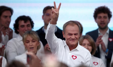 Donald Tusk, leader of the largest opposition grouping Civic Coalition (KO), gestures after the exit poll results of the national election are announced in Warsaw, Poland, October 2023