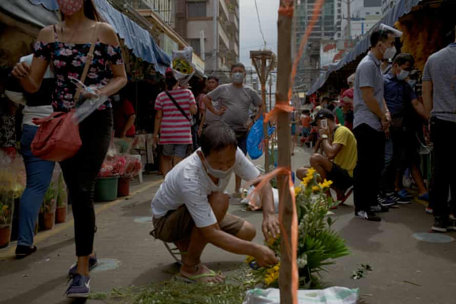 Filipino flower vendors preparing their products on the eve of Valentines day amidst the threat of new variants of coronavirus, on 13 February, 2021 in Manila, Philippines.