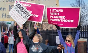 Planned Parenthood supporters and opponents hold signs in St Louis on 11 February 2017. 3581.jpg?width=300&quality=85&auto=forma