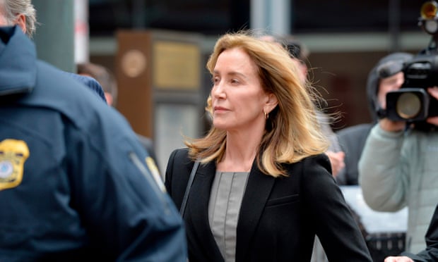 Actress Felicity Huffman cries as she pleads guilty in college admissions scandal