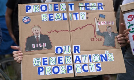 A protester holds up an anti-Brexit poster the day after the referendum.