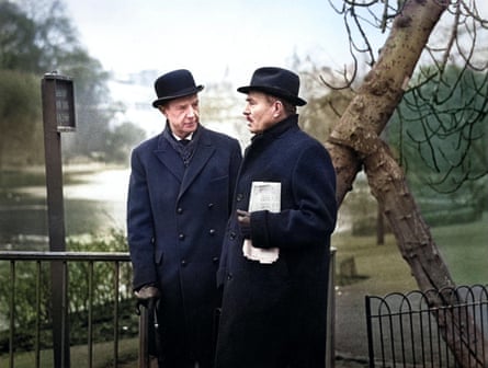 Robert Flemyng and James Mason wearing bowlers and coats in a park in The Deadly Affair