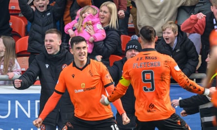 Jamie McGrath merayakan kemenangannya dari titik penalti di Tannadice.