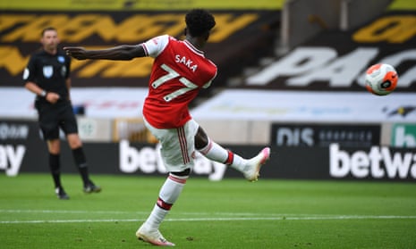 Bukayo Saka of Arsenal fires home the first goal of the game.