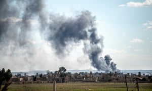 Smoke rises in the air after shelling hits Baghuz