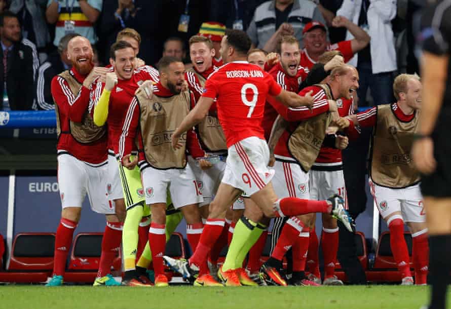 Wales’ squad celebrates with Robson-Kanu.