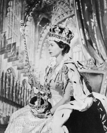 Queen Elizabeth II poses with the orb and sceptre on her coronation day.