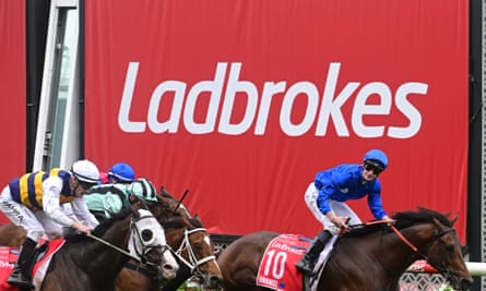 Ladbrokes sign at horse racing finish line