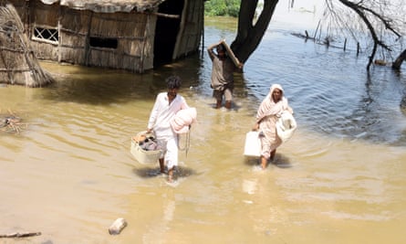 People affected by floods move to higher grounds in Jamshoro district, Sindh province, Pakistan.