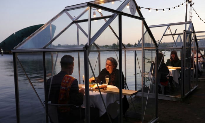 ‘Quarantine greenhouses’ are being tested at a restaurant in Amsterdam to allow customers to eat out in a safe environment.