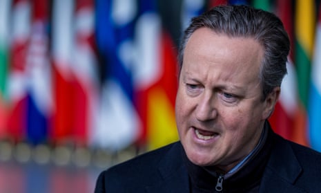 Britain's Foreign Secretary David Cameron speaks to the press after his arrival at NATO headquarters.