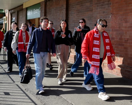 Sydney Swans fans seen leaving the SCG after the AFLW side beat Essendon on Sunday