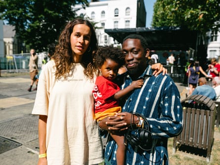 Alex and Errol with their young son.