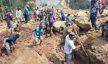 People digging at the site of a landslide at Yambali Village in the region of Maip Mulitaka, in Papua New Guinea's Enga Province