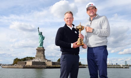 Luke Donald, Europe’s Ryder Cup captain, holds the trophy with the US’s Keegan Bradley in New York in October, with the Statue of Liberty in the background