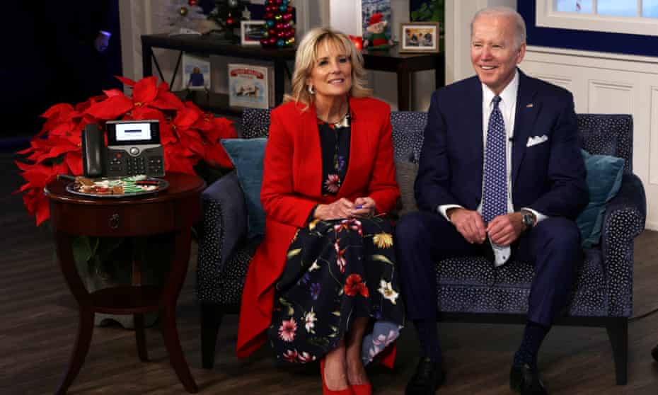 Joe Biden and Jill Biden participate in an event to call Norad and track the path of Santa Claus on Christmas Eve 2021 in Washington DC.