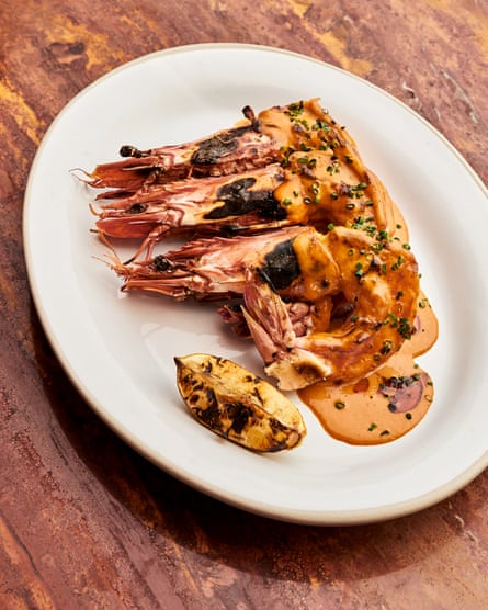 More than one passerby mouths appreciative things about my grilled peri peri tiger prawns – at Kudu, London W1.