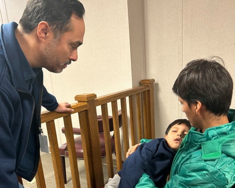 This handout image dated 28 January shows congressman Joaquin Castro visiting five-year-old Liam Conejo Ramos and his father, Adrian Conejo Arias, at the immigrant detention center in Dilley, Texas.