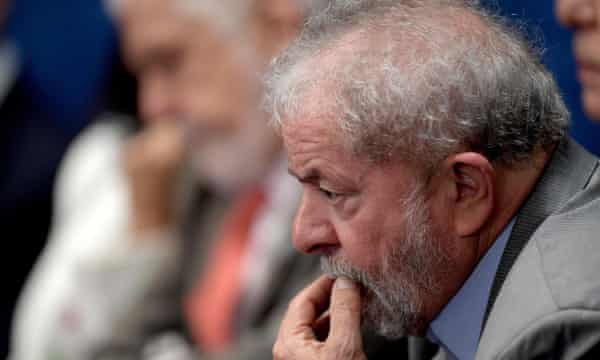 Former president Luiz Inácio Lula da Silva watches President Dilma Rousseff’s appearance at her impeachment trial intently.