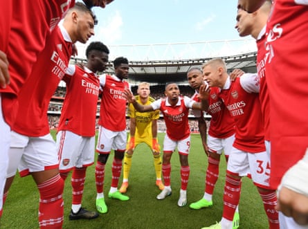 Arsenal’s players huddle before their match against Tottenham at the Emirates Stadium, which they won 3-1