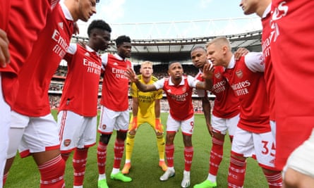 Arsenal take part in a team huddle before the Premier League match against Tottenham.