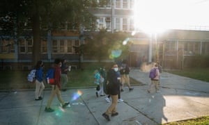Students arrive to the Bronx Alliance middle school on 1 October 2020 in New York.